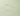 Close-up of a smear of clear gel on a light green background