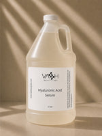 Large bottle of VASH Beauty Labs Hyaluronic Acid Serum on a beige background