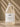 Large bottle of VASH Beauty Labs Hyaluronic Acid Serum on a beige background