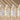 Four bottles of Vash Hyaluronic Acid Serum on a beige background