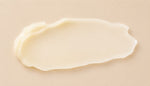 Close-up of a smooth, beige-colored balm on a matching background