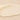 Close-up of a smooth, beige-colored balm on a matching background