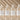 Four bottles of VISH Niacinamide Serum on a beige background