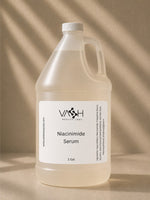 Large bottle of VASH Niacinimide Serum on a beige background