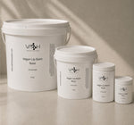 Set of Vash Beauty Labs Vegan Lip Balm Base containers on a neutral background